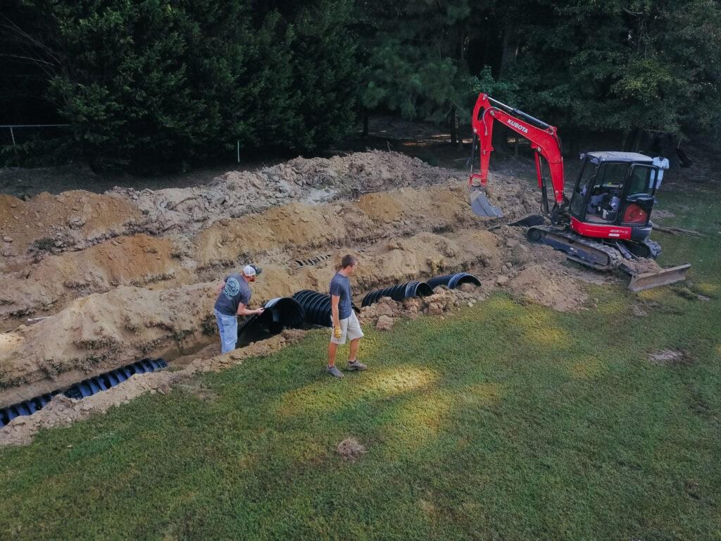 Bynum Septic employee's on a job site.